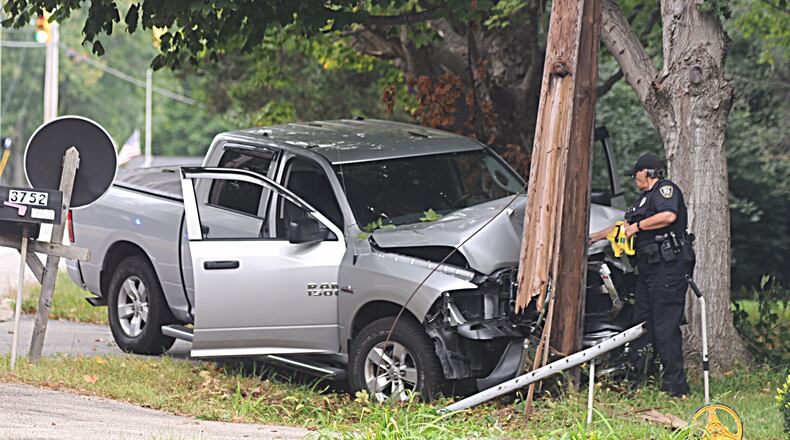 A pickup truck crash into a utility pole on Ohio 725 in Bellbrook Thursday. MARSHALL GORBY / STAFF
