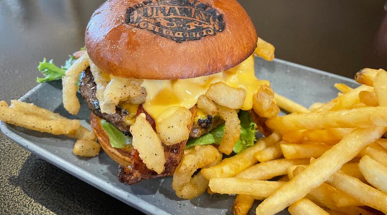 After reopening under new ownership in March, Dunaways in Troy has officially opened its kitchen this week with elevated bar food. NATALIE JONES/STAFF