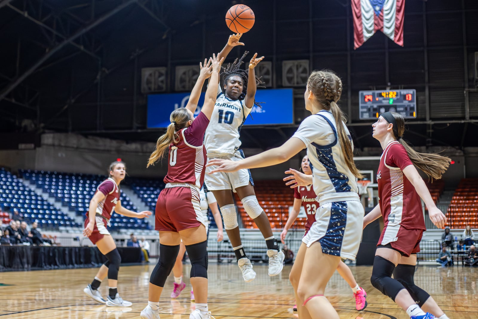 Fairmont High School sophomore Janiyah Hargrave passes the ball to junior Peyton Adams during their Division I regional semifinal game against Newark on Tuesday, March 3 at the Ohio Expo Center's Taft Coliseum. MICHAEL COOPER / STAFF