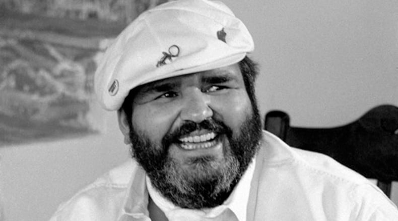 FILE-- Chef Paul Prudhomme, owner of K-Paul's Louisiana Kitchen, trying to reopen his roadshow version of K-Paul's after city health inspectors told him to close the premises, in New York, July 24, 1985. Prudhomme, the affable, bearded celebrity chef who took Cajun cooking from the bayou to the mainstream with his New Orleans restaurant, television shows, cookbooks and culinary products, died on Oct. 8, 2015, in New Orleans. He was 75.