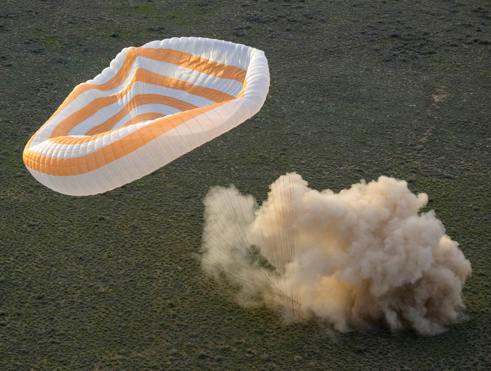The Soyuz MS-26 spacecraft lands in a remote area near the town of Zhezkazgan, Kazakhstan, with NASA astronaut Don Pettit and Roscosmos cosmonauts Alexey Ovchinin and Ivan Vagner aboard, Sunday, April 20, 2025. (Bill Ingalls/NASA via AP)