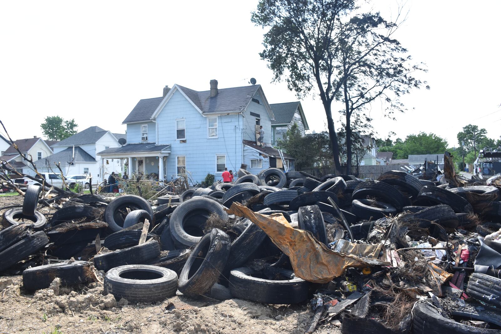 A tire pile on the 1400 block of Leonhard Street in Old North Dayton caught fire in May 2024. The Ohio EPA is working to remove the tires. CORNELIUS FROLIK / STAFF