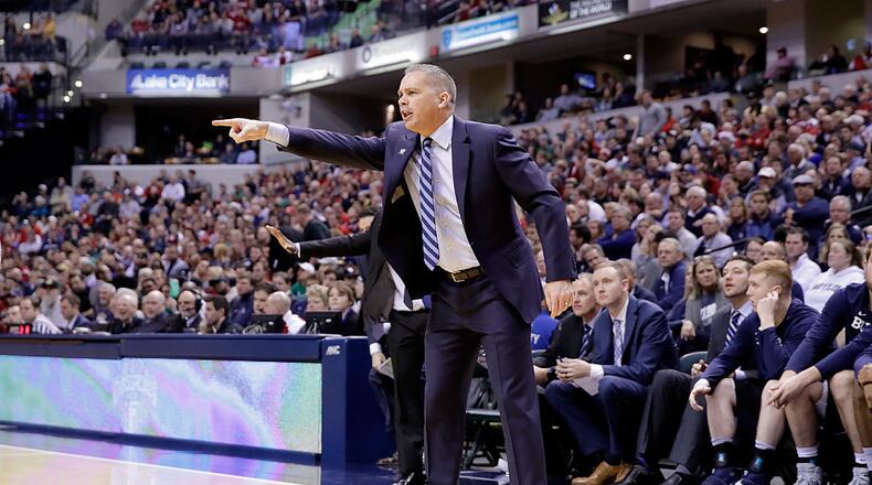 INDIANAPOLIS, IN - DECEMBER 17: Chris Holtmann the head coach of the Butler Bulldogs gives instructions to his team during the 83-78 win over the Indiana Hoosiers during the Crossroads Classic at Bankers Life Fieldhouse on December 17, 2016 in Indianapolis, Indiana. (Photo by Andy Lyons/Getty Images)