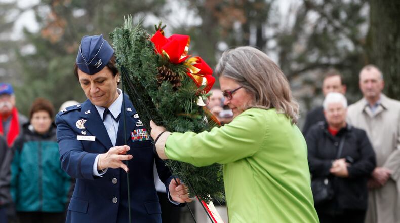 Col. Cassie Barlow, 88th Air Base Wing and Installation Commander and Amanda Wright Lane, great grand niece of the Wright Brothers, laid a wreath at the Wright Brothers Memorial Monday commemorating the 109th anniversary of powered flight.