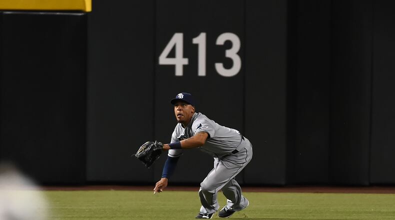 PHOENIX, AZ - JUNE 07: Desmond Jennings #8 of the Tampa Bay Rays makes a diving catch against the Arizona Diamondbacks during the second inning at Chase Field on June 7, 2016 in Phoenix, Arizona. (Photo by Norm Hall/Getty Images)