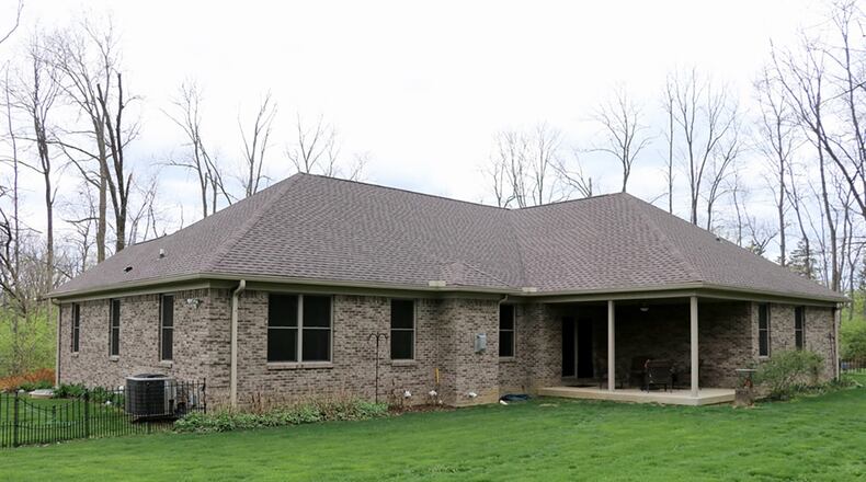 Sliding patio doors open from the dining area to the covered rear patio.
