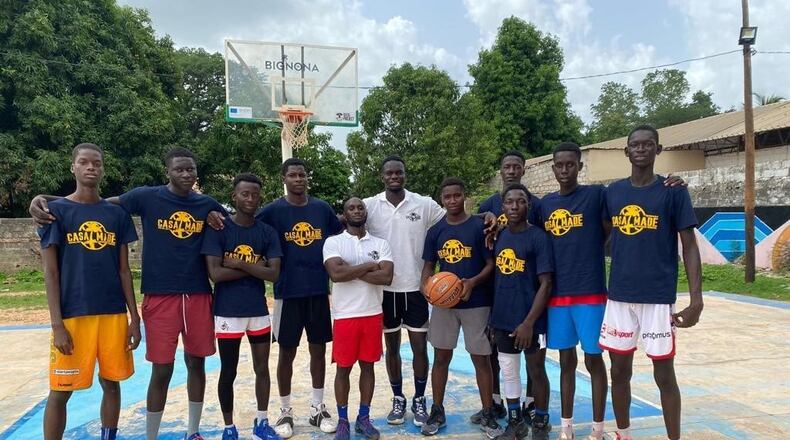 Central State basketball player Ibrahima Jarjou working with kids at the Casamance Made basketball camp he put on back in his hometown of Bignona, Senegal. Along with instruction, kids were given basketball shoes he had collected back in the United States or bought with money donated to the camp, as well as t-shirts, and food. (Contributed Photo)