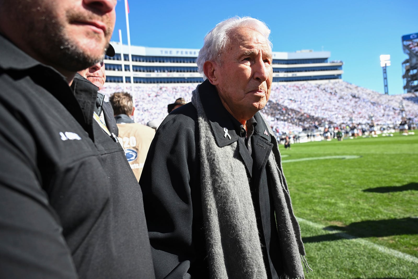 FILE - ESPN College GameDay analyst Lee Corso leaves the field before an NCAA college football game between Penn State and Ohio State, in State College, Pa., Nov. 2, 2024. (AP Photo/Barry Reeger, File)
