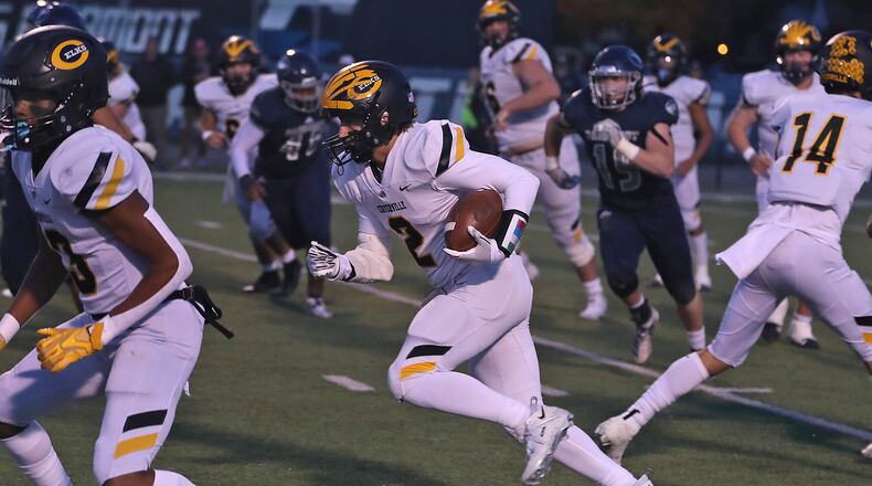 Centerville's Nic Bruder carries the ball after making a catch during against Fairmont. BILL LACKEY/STAFF