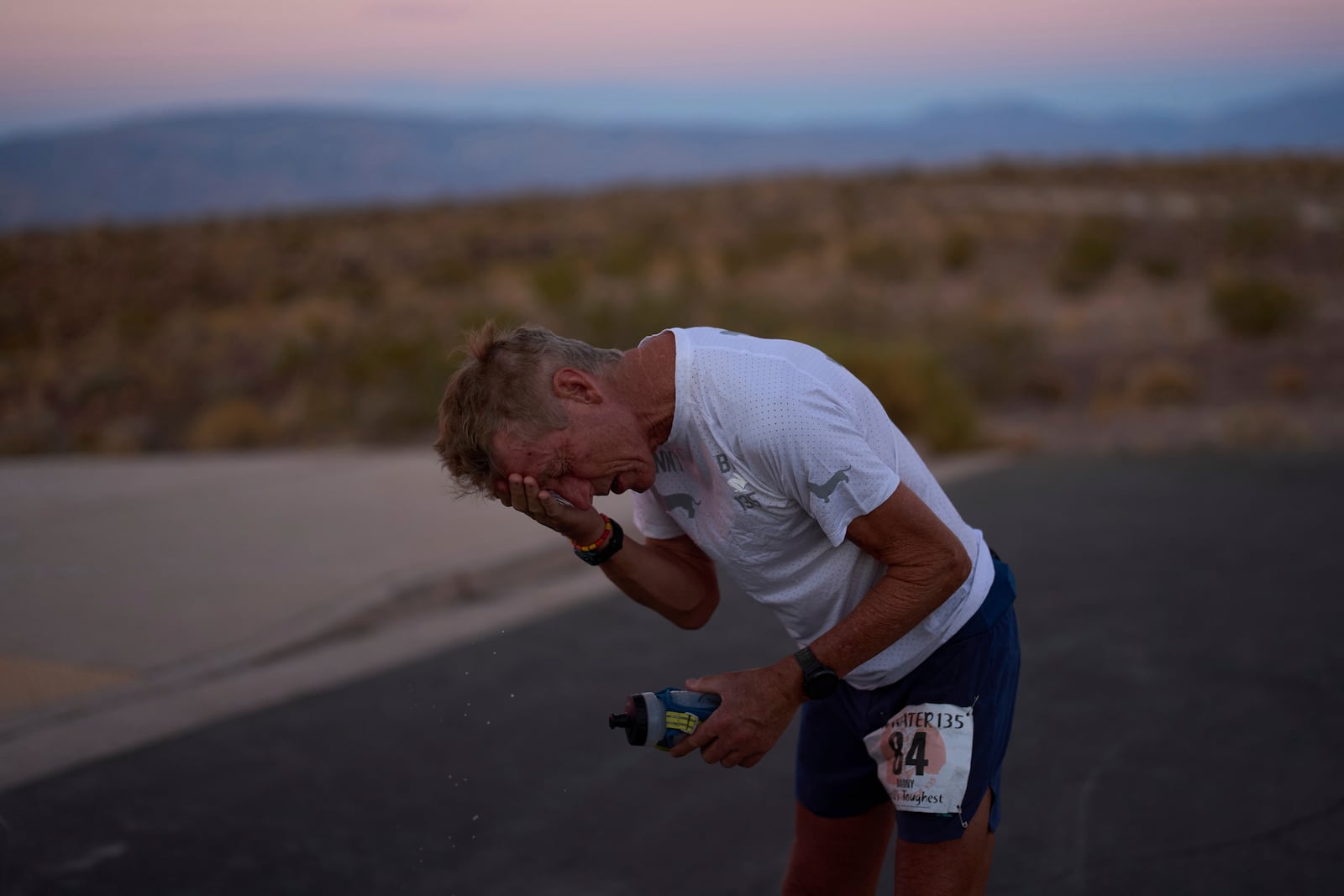 Danny Westergaard reacts while taking a break around the 24-hour mark during the Badwater 135 Ultramarathon, Tuesday, July 8, 2025, in Death Valley National Park, Calif. (AP Photo/John Locher)