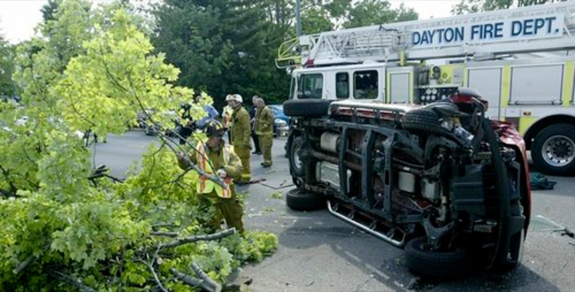 Truck hits tree, flips