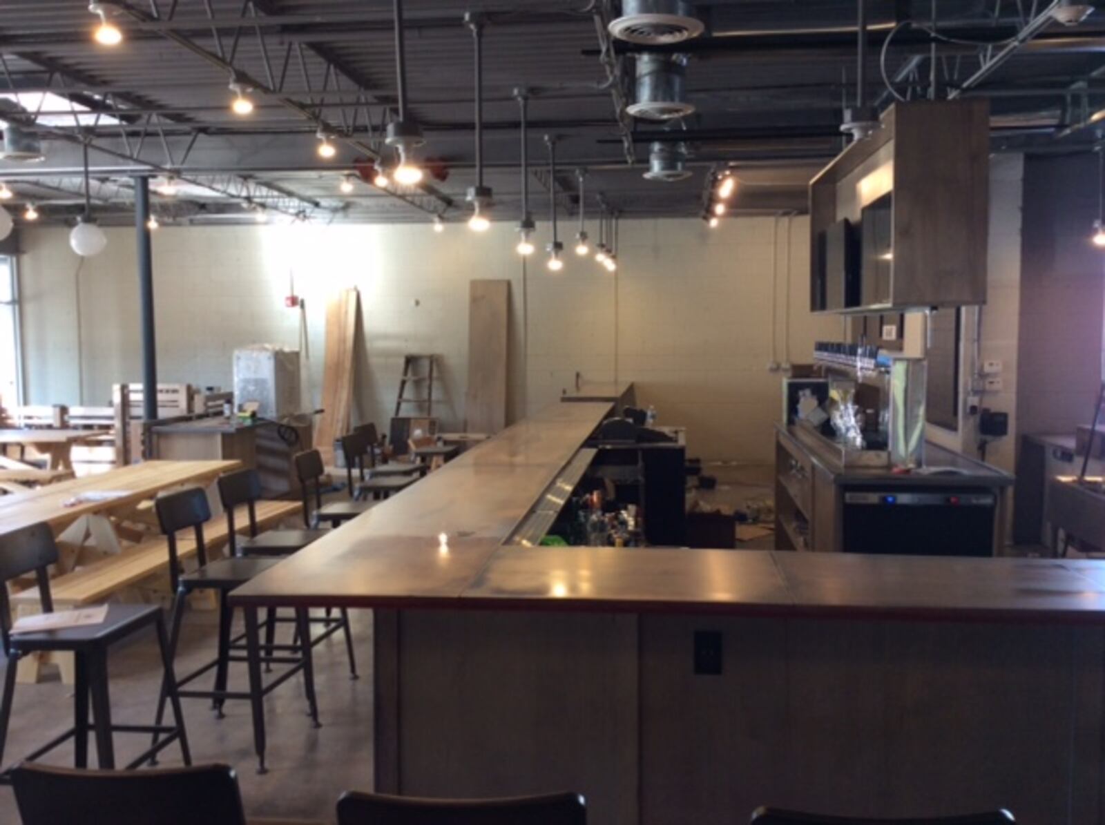 Old Scratch Pizza is scheduled to open to the public on Oct. 18. This is the bar area, still under construction. MARK FISHER/STAFF