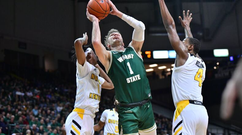 Wright State’s Bill Wampler battles in traffic during Friday night’s win over Northern Kentucky. Wampler scored 19 points and had six assists in the Raiders’ 95-63 win. Joseph Craven/WSU Athletics