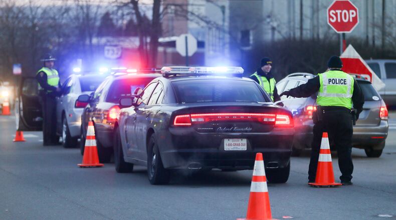 Police at an OVI checkpoint in Oxford. GREG LYNCH / STAFF