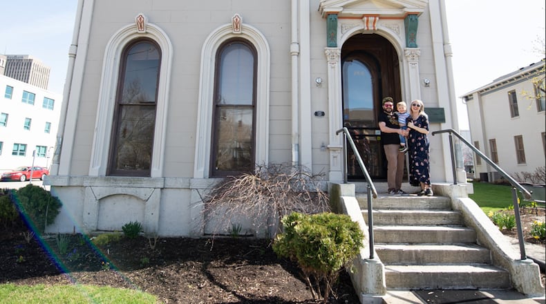 Mann (R) with her family in front of their newly renovated home - the Isaac Pollack house in 2022. The family moved in in 2023. L-R Husband Aaron Stephenson, holding River and Mann, pregnant with Finn. CONTRIBUTED