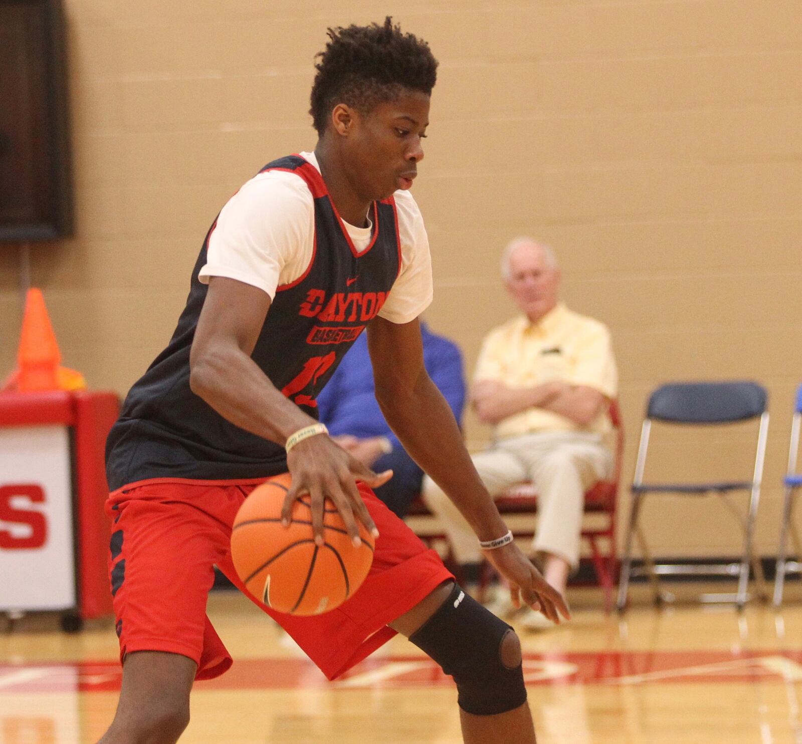 Kostas Antetokounmp practices as former Dayton coach Don Donoher, back left, and Bucky Bockhorn (next to Donoher in blue) watch at UD's Cronin Center on Sept. 20, 2017, in Dayton.