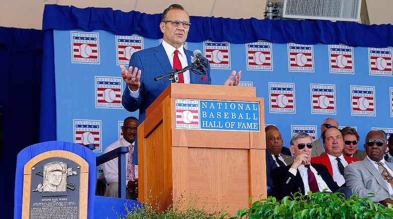 COOPERSTOWN, NY - JULY 27: Inductee Joe Torre gives his speech at Clark Sports Center during the Baseball Hall of Fame induction ceremony on July 27, 2014 in Cooperstown, New York. Torre managed for 29 seasons with 2,326 victories and led the New York Yankees to six American League pennants and four World Series titles. (Photo by Jim McIsaac/Getty Images)