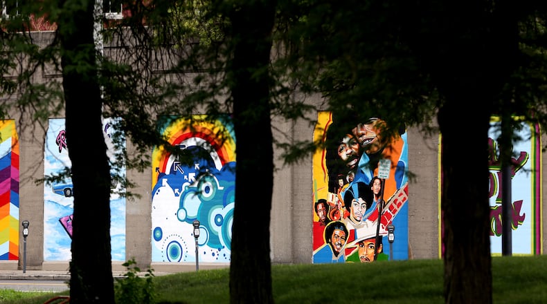 "Land of Funk," a 21-panel tribute to Dayton funk, has been painted along the Stone Street railroad wall. LISA POWELL / STAFF