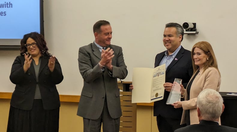Opportunities for Ohioans with Disabilities director Kevin L. Miller (middle left) recognizes Erhardt Preitauer, president and CEO of CareSource (middle right), and Jennifer Dougherty, chief human resources officer at CareSource (far right), with the 2023 Governor’s Inclusive Employer Award during an event on Thursday, Oct. 26, at CareSource's corporate office. Crown Equipment Corporation also received a 2023 Governor’s Inclusive Employer Award. SAMANTHA WILDOW\STAFF