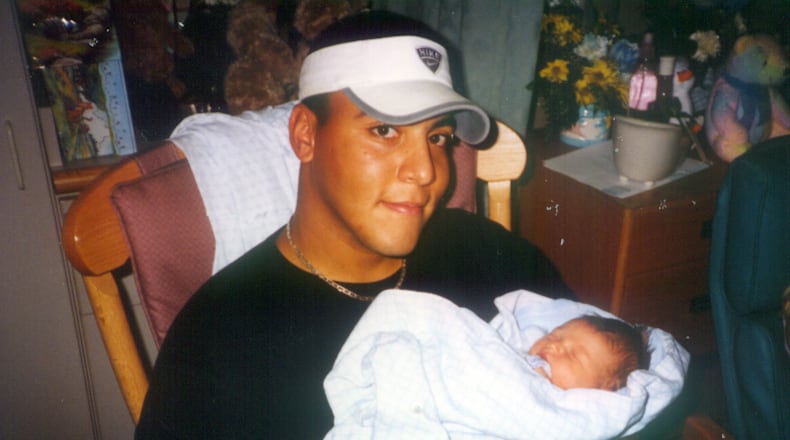 Steve Burress shown in a family photo with his child.