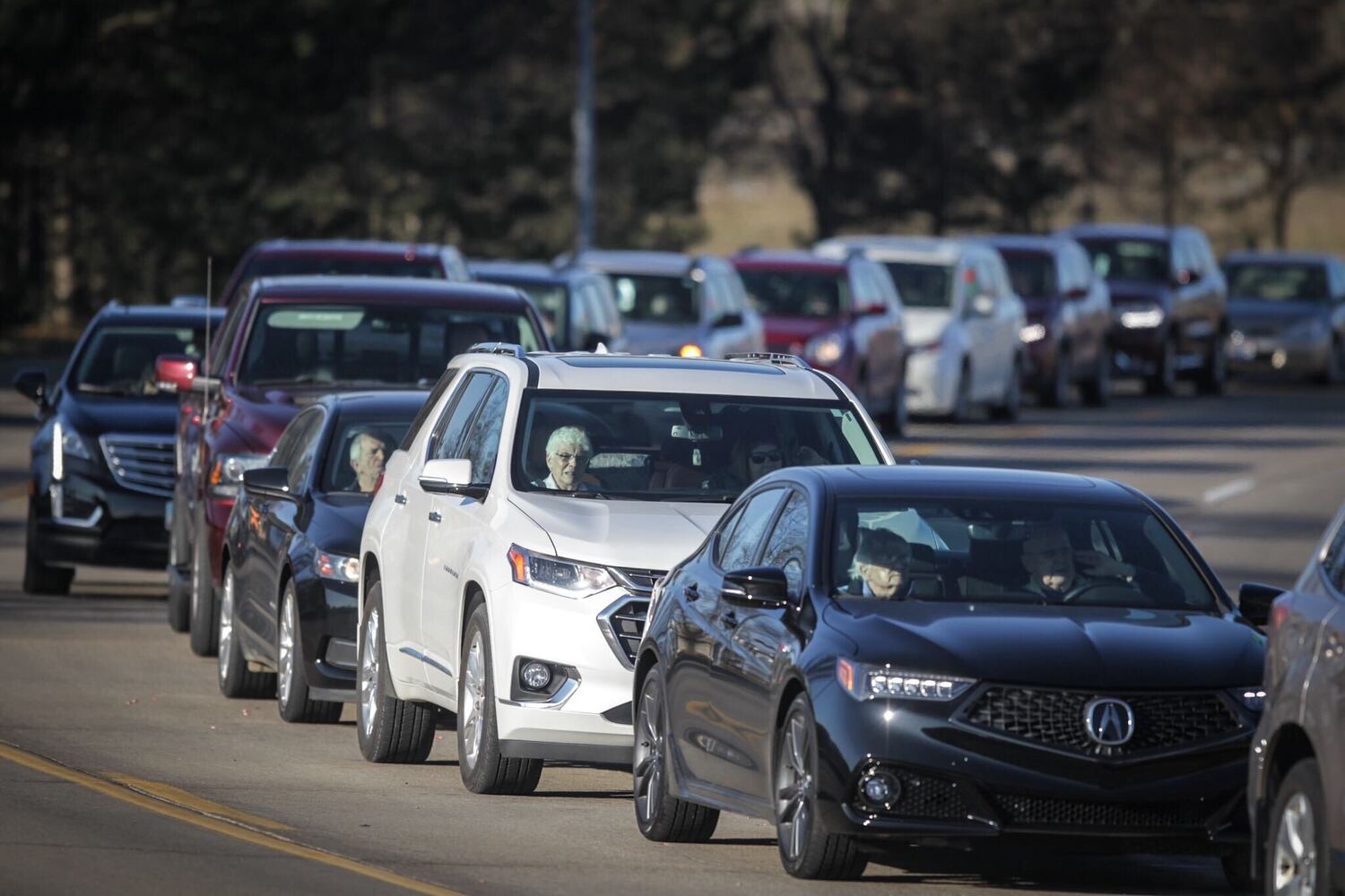 Cars line up for a coronavirus vaccine clinic at UD Arena