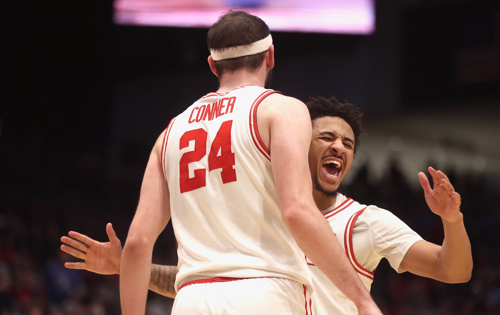 Dayton's Javon Bennett, right, reacts after Jacob Conner scored and drew a foul in the second half against George Washington on Tuesday, Jan. 6, 2026, at UD Arena. David Jablonski/Staff