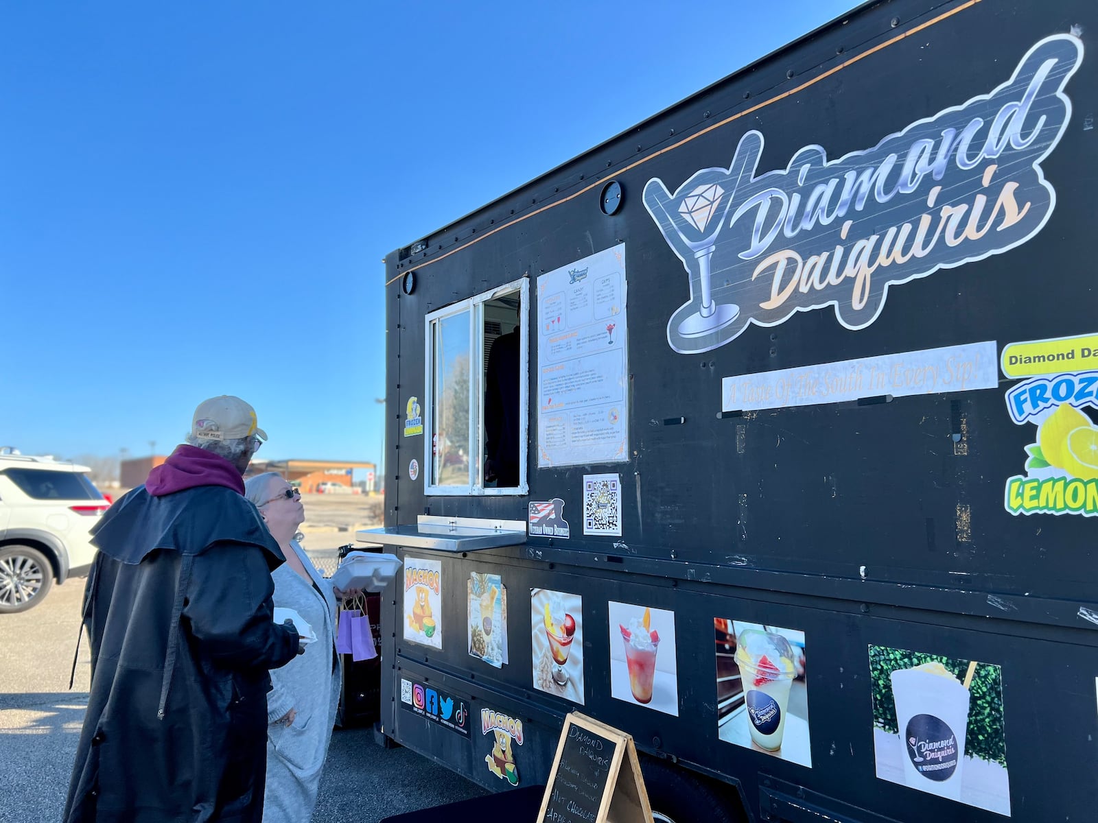 Bruce Keller and Elaine Bradley visit Diamond Daiquiris during Sunday's community give back event in Huber Heights on Sunday. AIMEE HANCOCK/STAFF
