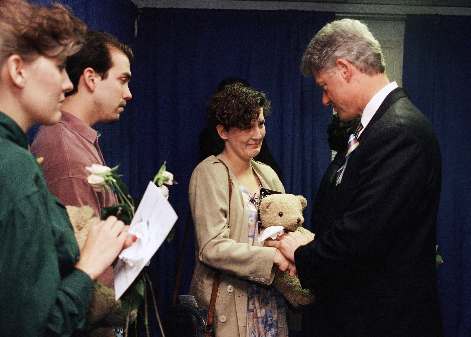 FILE - Aren Almon greets President Bill Clinton after a prayer service for the victims of the deadly truck bomb attack in Oklahoma City on April 23, 1995. (AP Photo/Pat Sullivan, File)