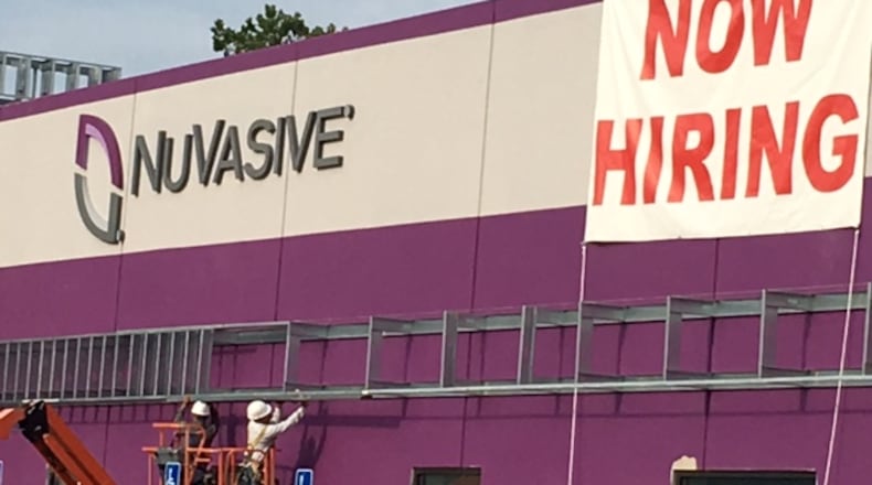 NuVasive Inc., which announced a move from Fairborn to West Carrollton in late 2015 as part of a $45 million expansion, is looking to hire for at least 30 positions for area operations. NICK BLIZZARD/STAFF WRITER