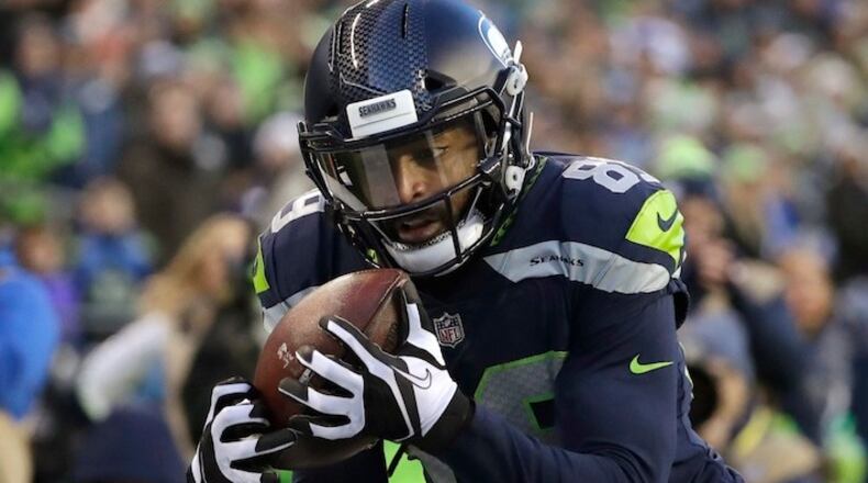 Seattle Seahawks wide receiver Doug Baldwin makes a catch for a touchdown against the Arizona Cardinals in the second half of an NFL football game, Sunday, Dec. 31, 2017, in Seattle. (AP Photo/Elaine Thompson)