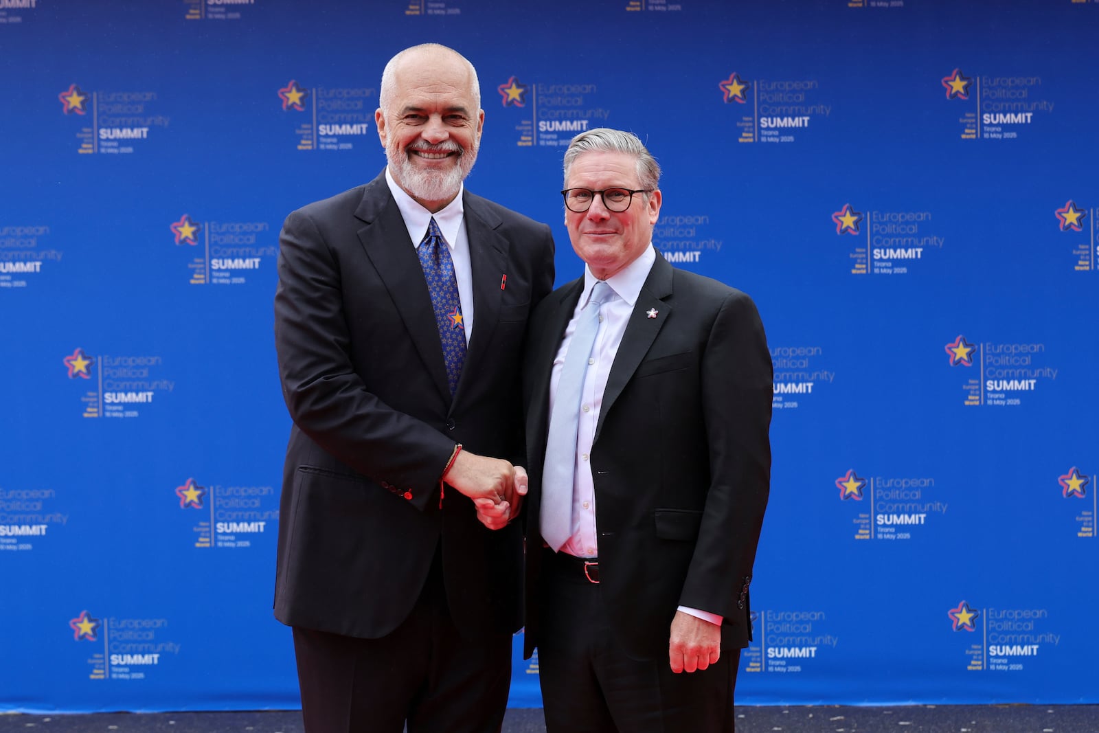 Albanian Prime Minister Edi Rama, left, welcomes Britain's Prime Minister Keir Starmer ahead of a summit where the leaders of 47 European countries and organizations will discuss security, defense and democratic standards against the backdrop of Russia's war on Ukraine, in Tirana, Albania, Friday, May 16, 2025. (AP Photo/Vlasov Sulaj)