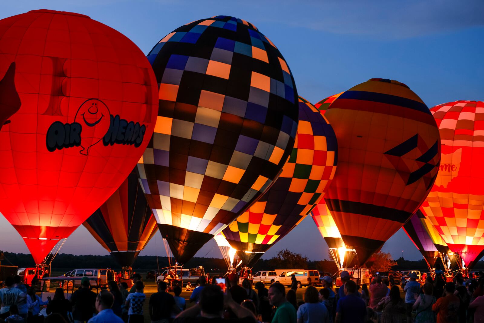 The Ohio Challenge Hot Air Balloon and Skydiving Festival kicked off the weekend event Friday, July 19, 2024 at Smith Park in Middletown with balloon launch and glow, flag and pyrotechnics jumps by Team Fastrax, fireworks show by Yokum Fireworks, a drone show and more. NICK GRAHAM/STAFF