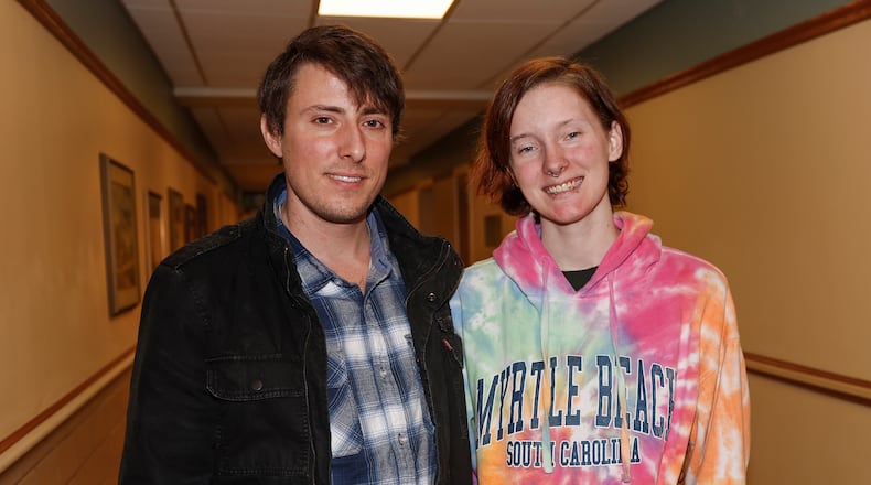 Trevor Adams, left, and his girlfriend Mariah Harville in a hallway at Kettering Health's main campus on Friday, Feb. 27, 2026, in Kettering. Harville supported Adams, 35, as he recently survived cardiogenic shock, a life-threatening condition many people don't live through, where the heart stops pumping enough blood. JOSEPH COOKE/STAFF