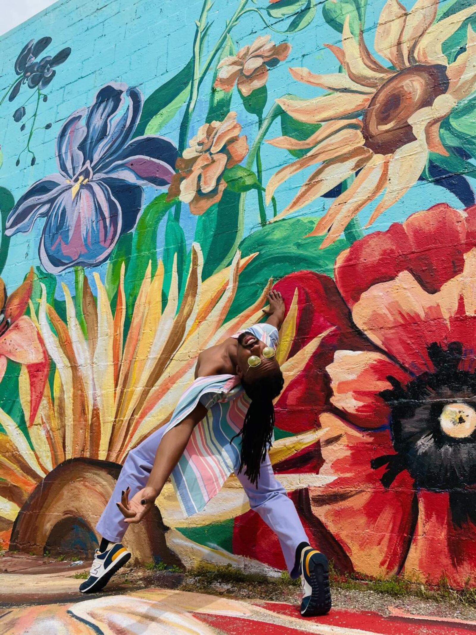 Dayton Dance Initiative company member Quentin Sledge. CONTRIBUTED/MURAL BY TIFFANY CLARK.