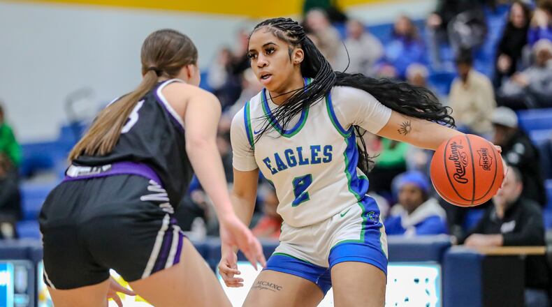 Chaminade Julienne High School senior Tiyah Parker dribbles the ball during their game on Wednesday night at Springfield High School. MICHAEL COOPER/CONTRIBUTED