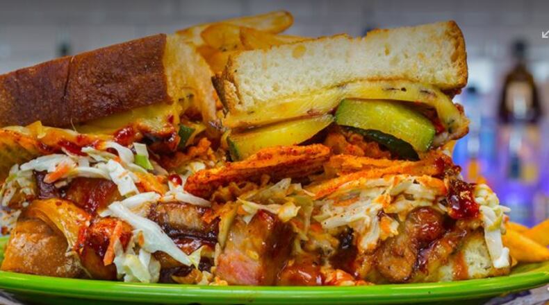 "Smokey & The Riblet" is Melt Bar & Grilled's sandwich of the month for August. It's made with boneless slow-roasted pork ribs, hickory smokehouse BBQ sauce, creamy crunchy slaw, spicy garlic pickles, BBQ kettle chips and smoked gouda. PHOTO / meltbarandgrilled.com
