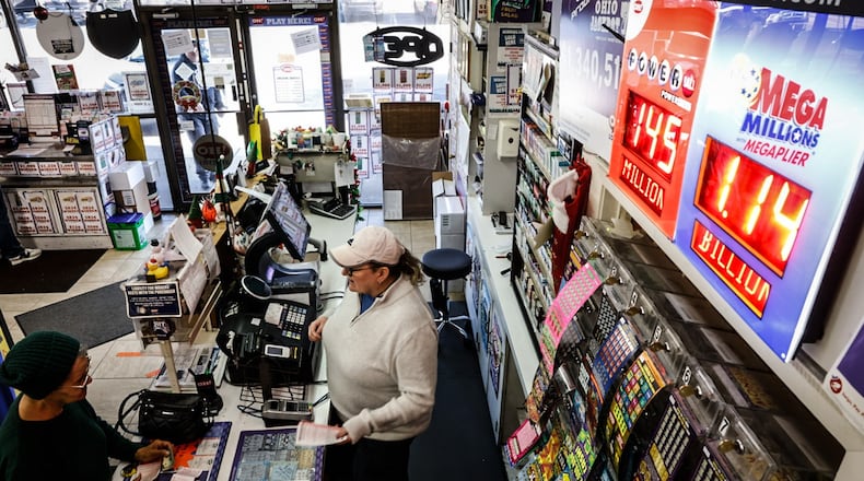 Bee-Gee's Mini Market manager Jackie Porter is selling lots of Mega Million tickets because the jackpot is over $1 billion. Bee-Gee's is located on Bigger Road in Kettering. JIM NOELKER/STAFF