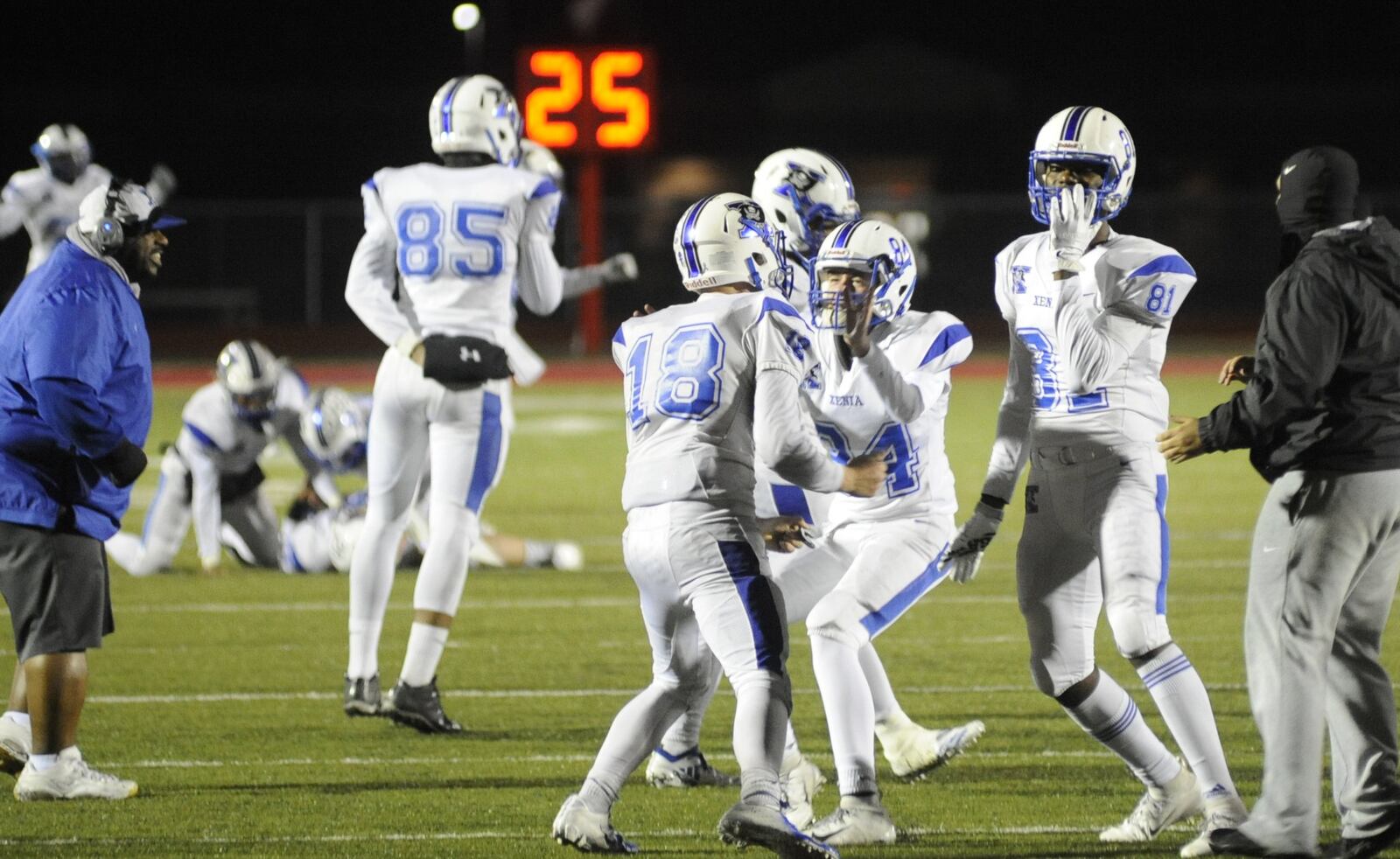 Xenia players celebrate a 29-28 double OT defeat of host Trotwood-Madison in a Week 9 high school football game on Friday, Oct. 19, 2018. MARC PENDLETON / STAFF