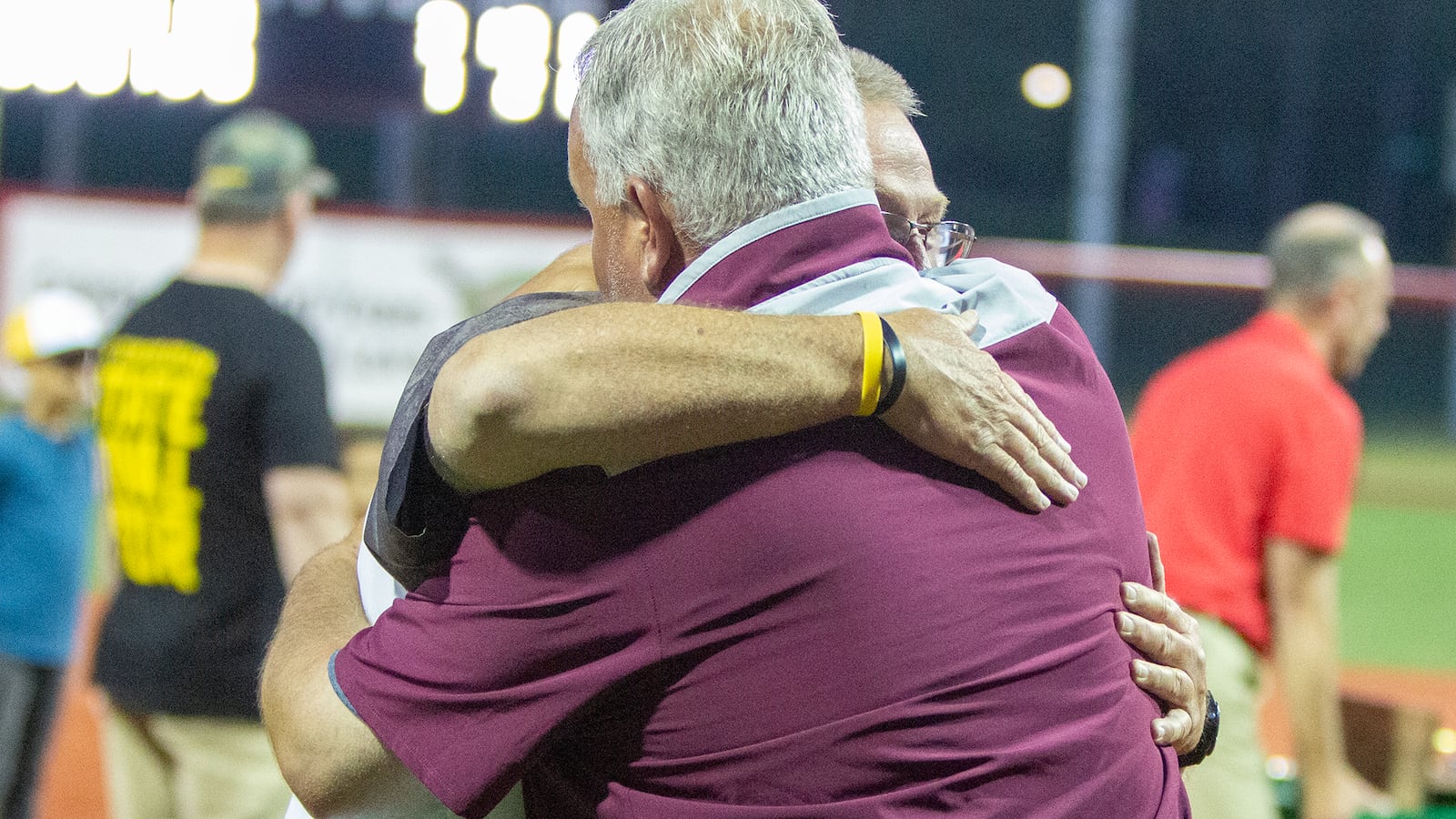 Longtime friends Lebanon coach Brian Kindell and Centerville coach Wendell Hutchinson embrace after Kindell's team won the Division I state championship Sunday in Akron. Jeff Gilbert/CONTRIBUTED