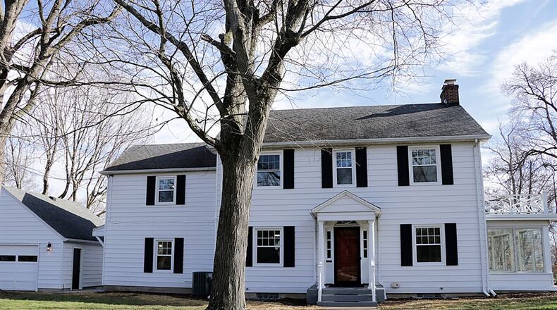 Sitting on a corner lot, the renovated 2-story has a 4-season sun room, a main-bedroom suite, refinished hardwood floors, totally renovated bathrooms and an updated kitchen. CONTRIBUTED PHOTO BY KATHY TYLER