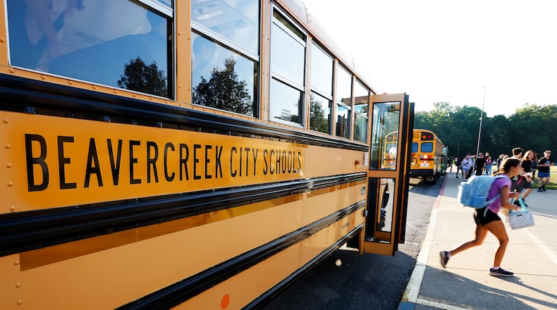 Students arrive Wednesday, Aug. 14, 2024 for the first day of school at Beavercreek High School. MARSHALL GORBY\STAFF