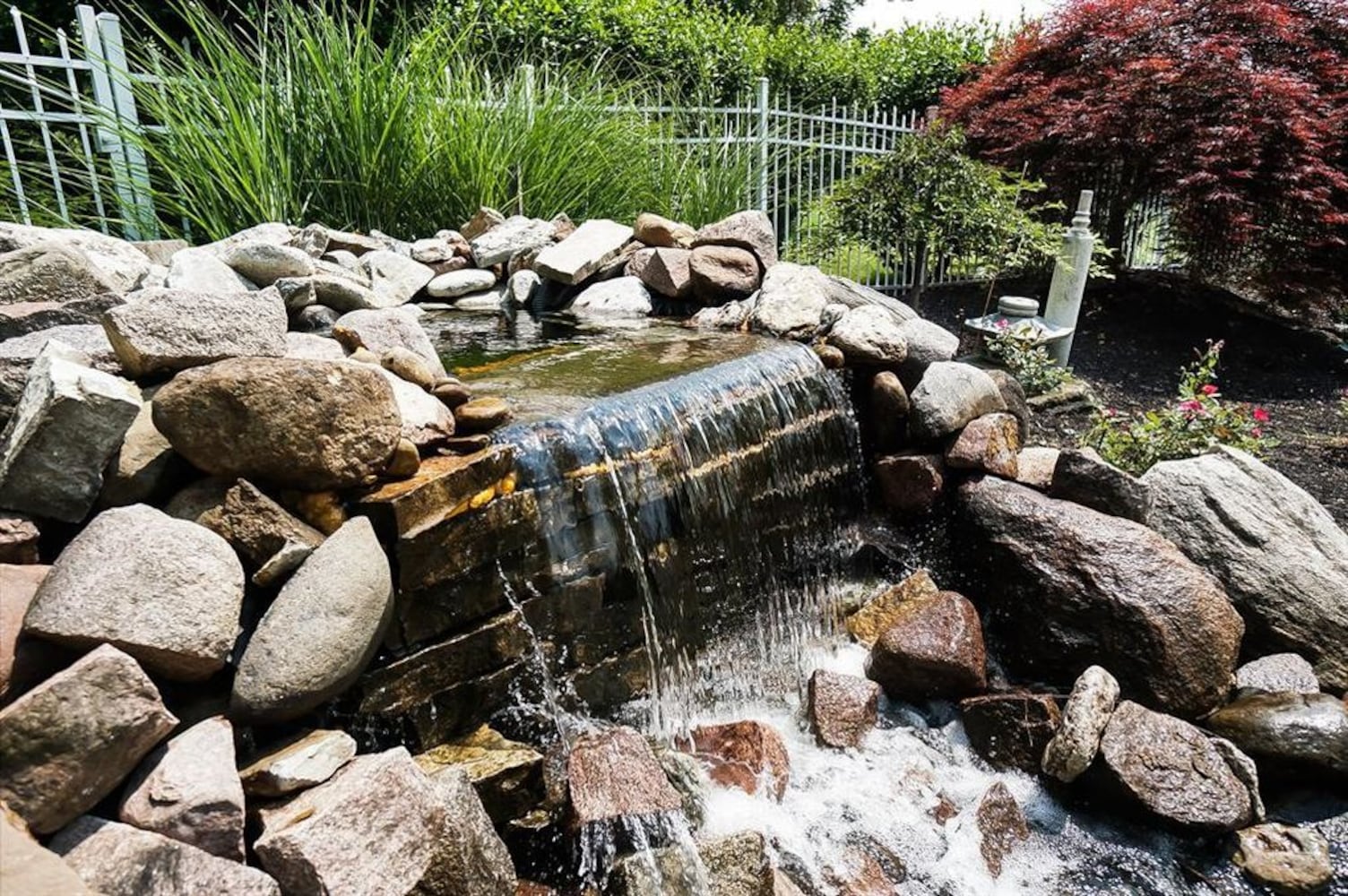Photos: $1M luxury home listed has waterfall, swimming pool and kitchen to die for