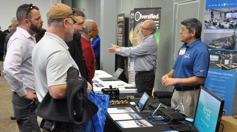 Tech Expo visitors meet with vendors from the private sector to collaborate on mission requirements and technology solutions Feb. 21, 2018, at the Hope Hotel and Conference Center, Wright-Patterson Air Force Base. (U.S. Air Force photo/2nd Lt. Weston Woodward)