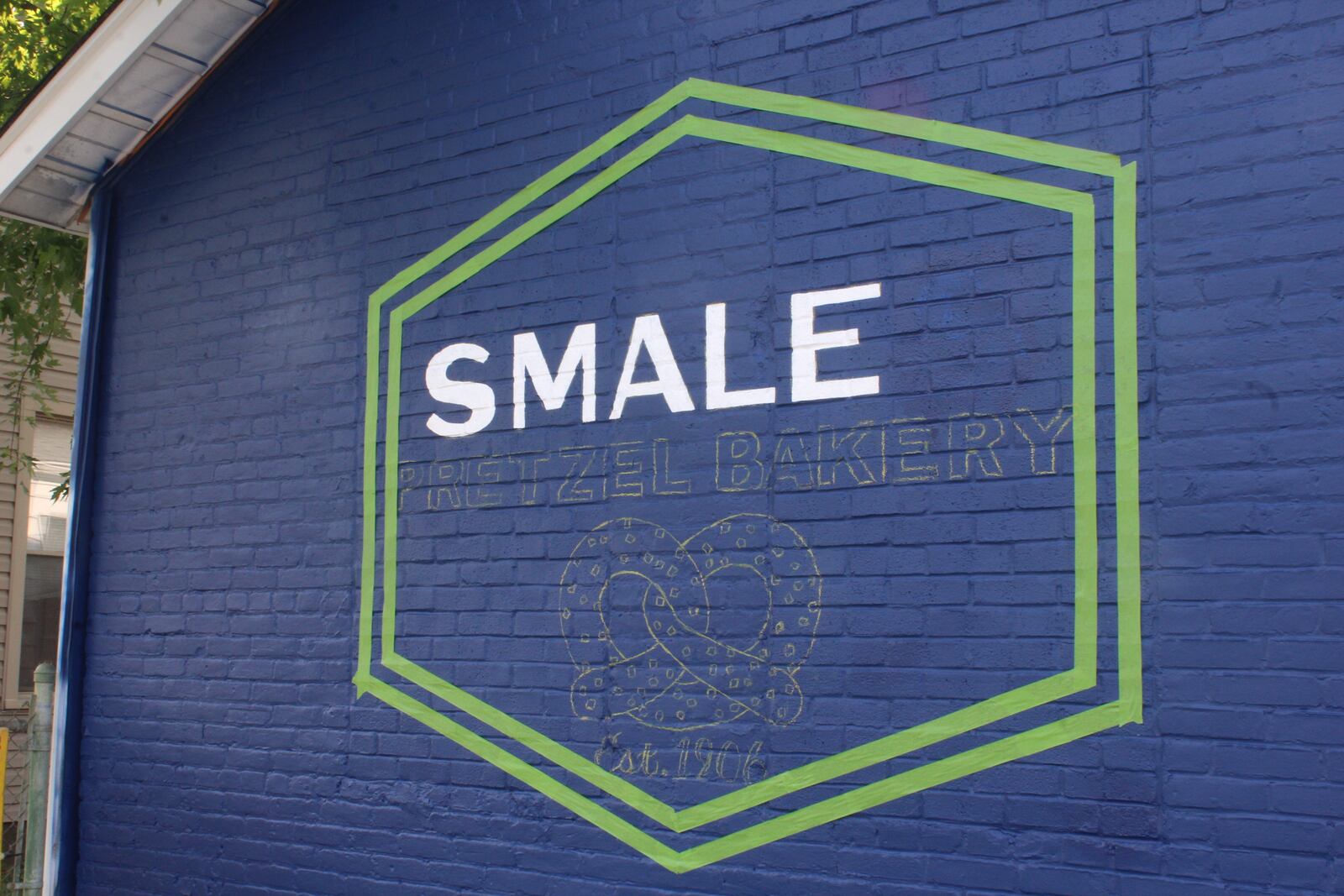 Smales Pretzel Bakery is getting a new sign. The sign is shown in progress here. 