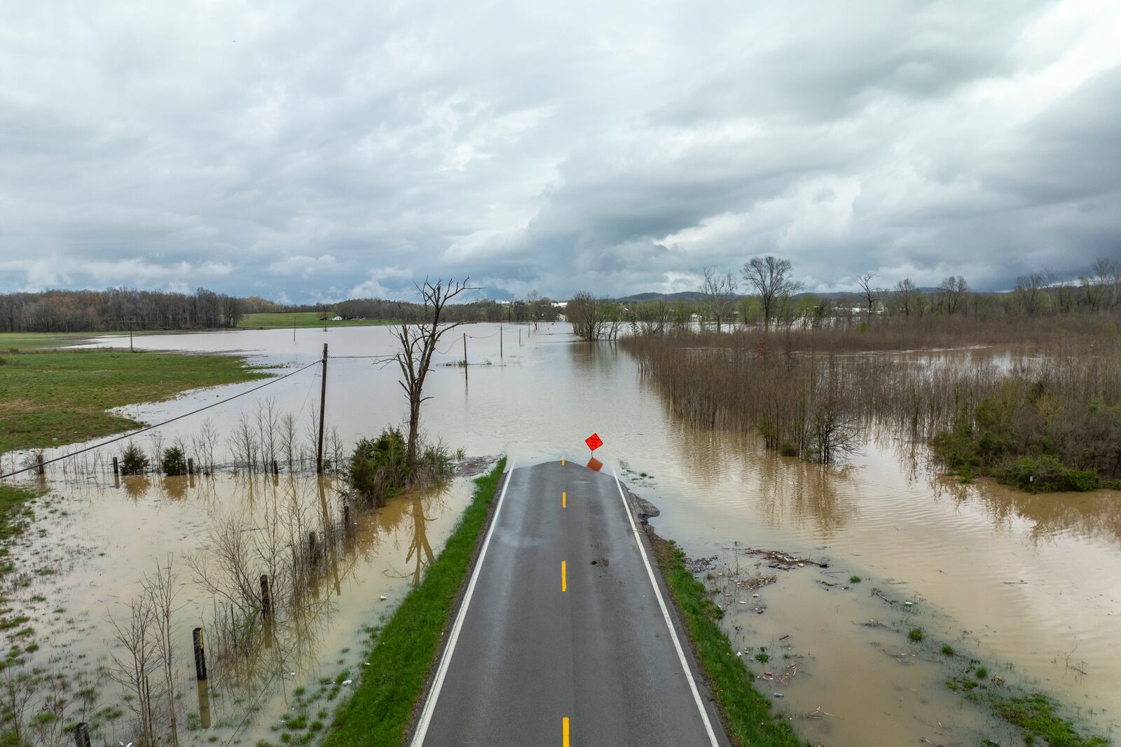 Floodwaters cover Kentucky Route 39 in Lincoln County, Ky., on Friday, April 4, 2025. (Ryan C. Hermens/Lexington Herald-Leader via AP)