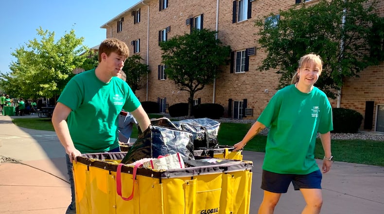 Student volunteers help push students' belongings during Operation Move-In Day at Wright State University, Monday, Aug. 18, 2025. LONDON BISHOP/STAFF