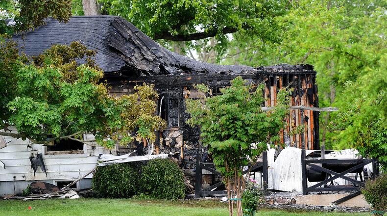 One person is dead and another was taken to the hospital after a house fire on Denlinger Road in Trotwood early Monday morning, May 23, 2022. MARSHALL GORBY\STAFF