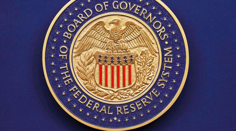 FILE - A seal is seen before Federal Reserve Chairman Jerome Powell walks out to speak during a news conference following the Federal Open Market Committee meeting, Sept. 17, 2025, at the Federal Reserve Board Building in Washington. (AP Photo/Jacquelyn Martin, File)