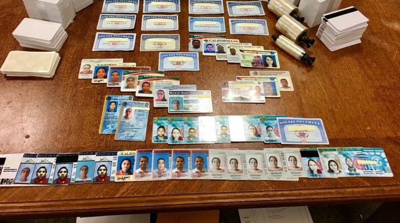 Several forms of fake identification cards were seized from two Dayton residences as part of a United States Secret Service investigation. Two men were sentenced Wednesday to 24 and 21 months in prison. MARK GOKAVI/Staff
