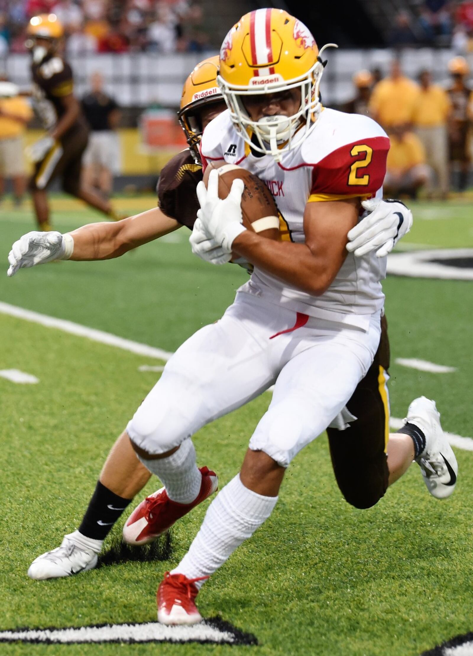 Alter’s Derek Willits (9) is about to get a grip on Fenwick’s R.J. Clesceri (2) during Friday night’s game at Centerville Stadium. Alter won 45-20. CONTRIBUTED PHOTO BY ANGIE MOHRHAUS